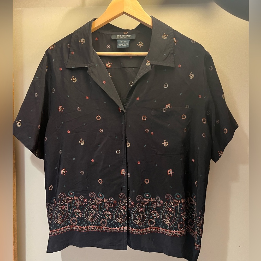 Button up with cool design. Size L but has a cropped fit.